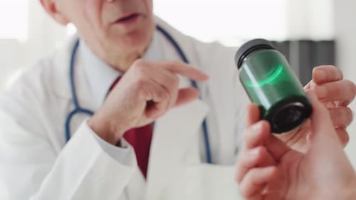 Close up of doctor giving patient the pills. Shot with RED helium camera in 8K