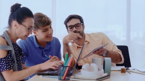 Group Meeting of Creative Business People Designer and Artist at Office Desk