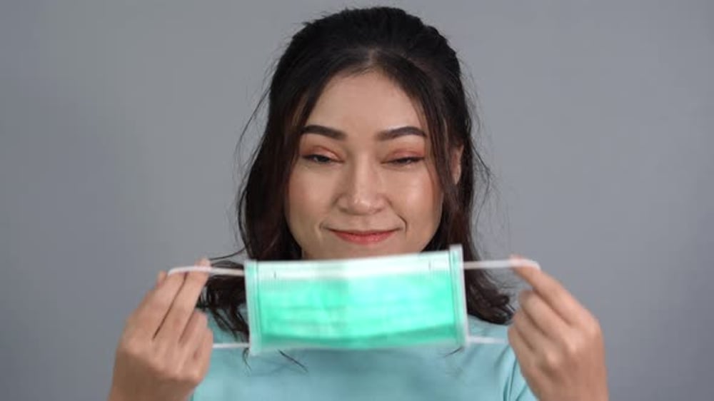 Woman Puts on a Disposable Face Mask, Medical Stock Footage ft. woman ...