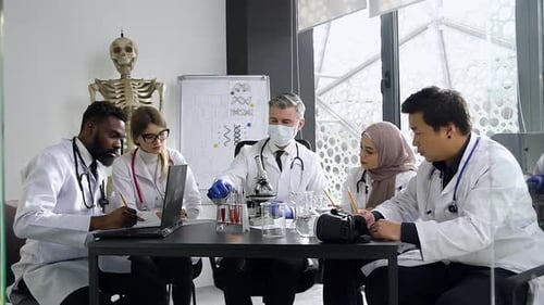 Medical Research Team Meeting and Review in Lab