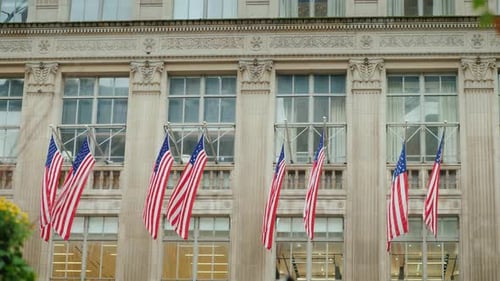 Building Adorned with American Flags in City