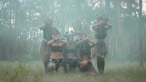 Mystical Group in Costume Posing in Forest