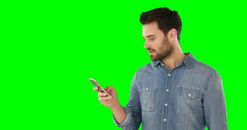 Smiling man using mobile phone