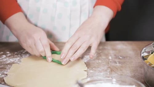 Cutting Christmas Tree Cookies from Dough at Home