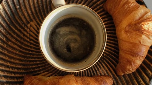 Overhead of Coffee and Flaky Croissants for Breakfast
