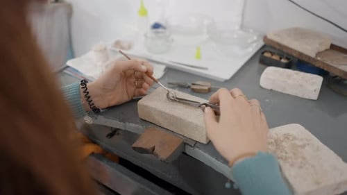 Hands Of Female Jeweler Creating Jewelry In Her Workshop Close Up