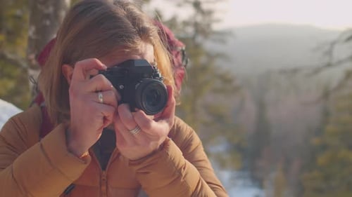 Photographer Hiker Captures Snowy Mountain Scene