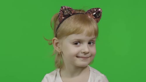 Cute Child Smiles on a Green Screen