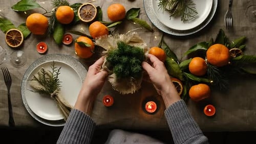 Holiday Table Setting With Tangerines and Candles