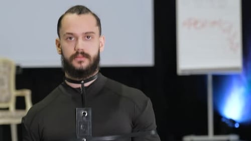 Bearded Male Model Walks Down Fashion Podium Runway Trendy Men Vogue Catwalk