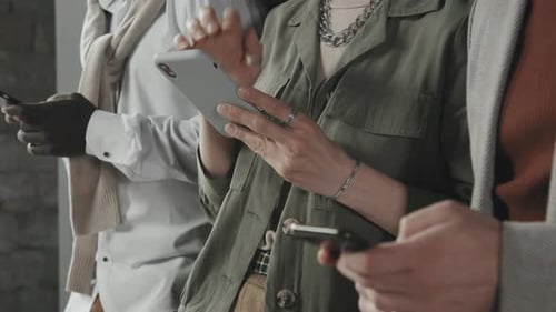 Unrecognizable People Using Smartphones