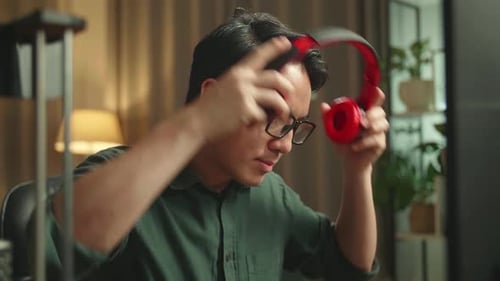 Asian Man Start Works On Personal Computer And 3D Printer In Home Office, He Works At Night