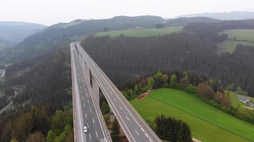 Aerial View of the Highway Viaduct on Concrete Pillars in the Mountains