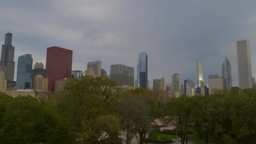 green trees in city overlooking Chicago skyline, United States