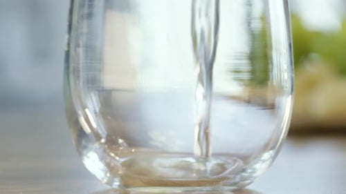Water Pouring into a Glass Close-Up