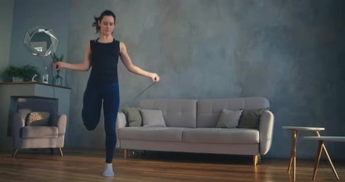 Woman Skipping Rope for Exercise at Home