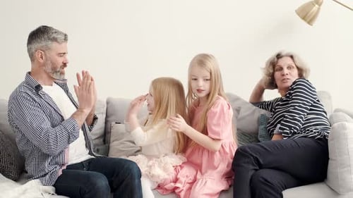 Family Playing Patty Cake Game Together