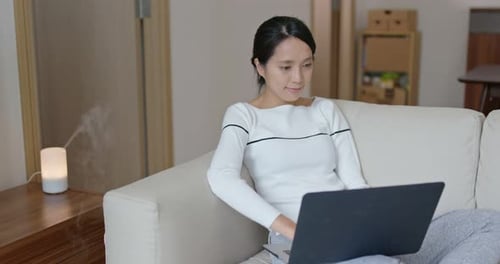 Woman work on computer at home