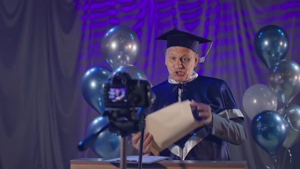 Male Rector in Mantle Solemnly Conducts Graduation Ceremony for ...