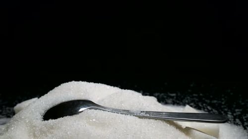 Pile of Sugar with Spoon Close Up