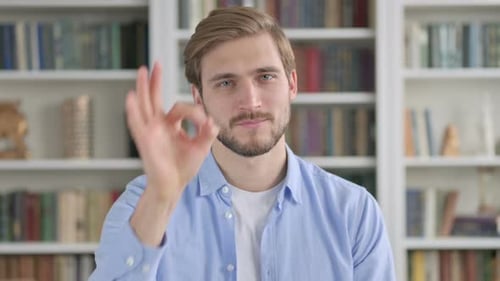 Man Makes Ok Gesture Smiling At Camera