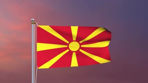 Waving Flag of North Macedonia Against Vibrant Sunset Sky