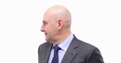 Adult Man in Suit Turns His Head