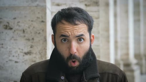 Bearded Man Reacts with Surprise, Close Up
