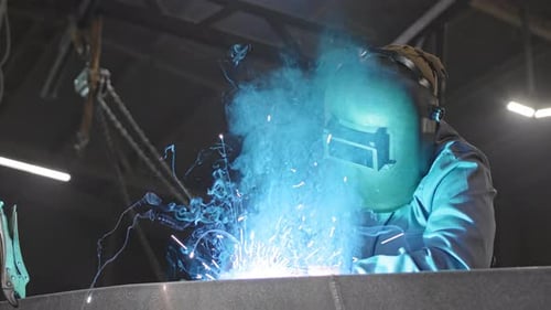 Person Wearing Helmet Welding