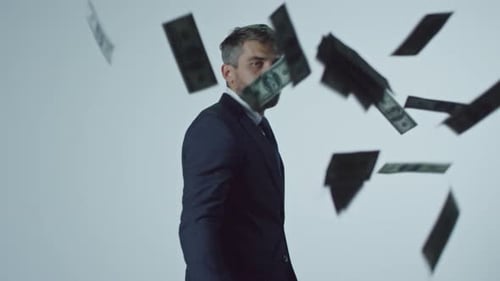 Successful Businessman Throwing Money to Camera