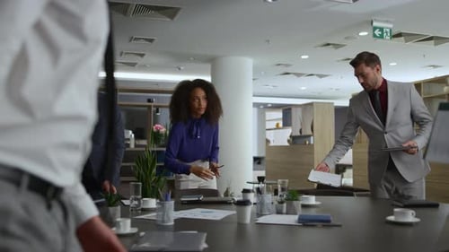 Multiracial Office Team Discuss Corporate Data on Business Conference Meeting