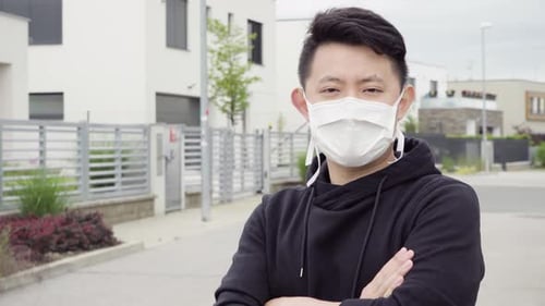 Adult Wearing Face Mask Gives Thumbs Up