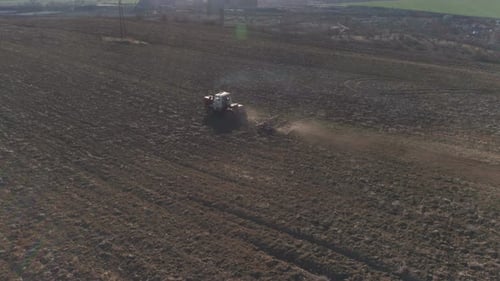 Agricultural Tractor Cultivating Field