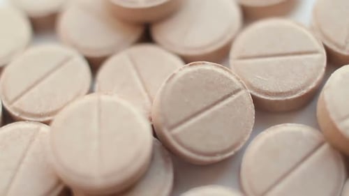 Medical Pills Placed on Rotating Table, Close Up