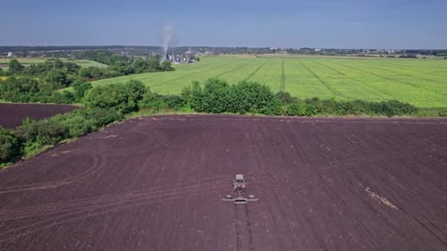 Aerial View of the Tractor Plow a Ground