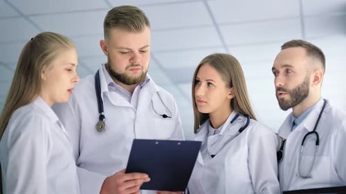 Medical Specialist Team Talking with Each Other at Hospital Low Angle