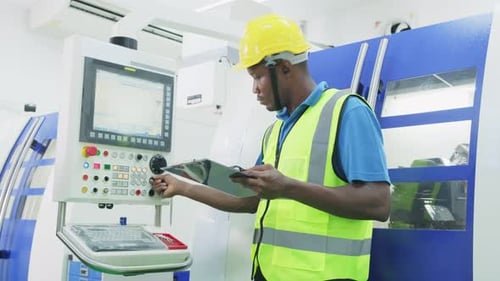 African worker people wearing protective safety helmet and glasses in production line of factory.
