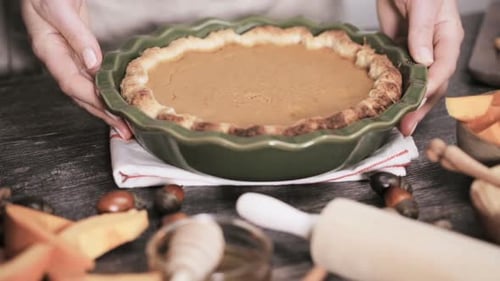 Step by step. Decorating pumpkin pie with baked leaves. Baking home made pumpkin pie for Thanksgivin