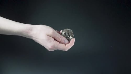 Hand Holding Bitcoin Coin