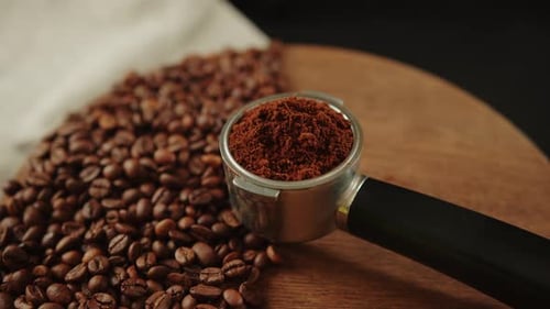 Ground Coffee and Beans on Wooden Board