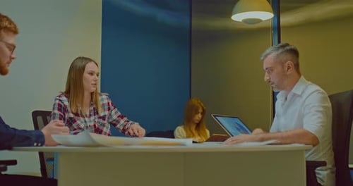 Team Having a Meeting in a Modern Office