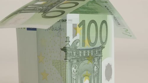Slow tilt real estate metaphor of EU paper money 4K 2160p 30fps UHD footage - Close-up of hundred E
