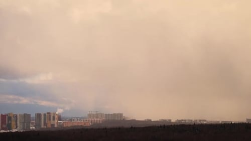 Winter over the city houses in the snow and a snowstorm, time lapse