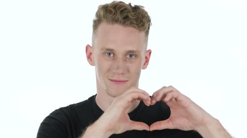 Young Adult Makes Heart Shape With Hands