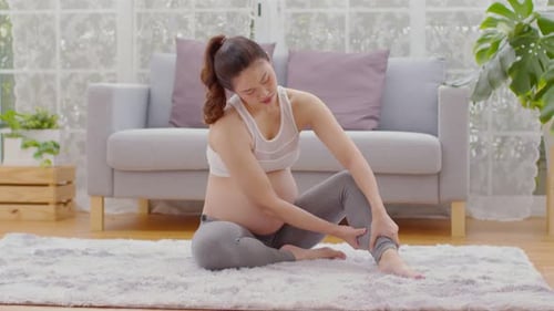 Pregnant woman touching and massage on calf leg so painful and Cramps sudden