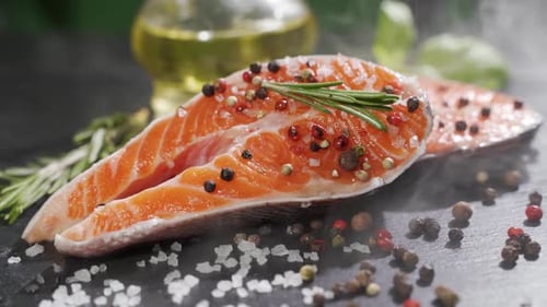 Close Up View of Seasoning Process of Salmon’s Fillet.
