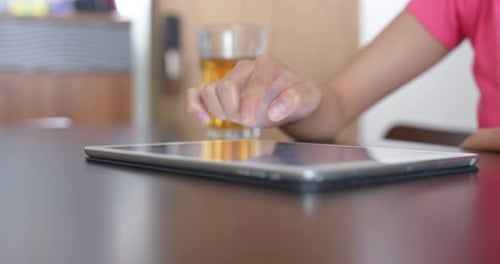 Woman use of tablet and place on table