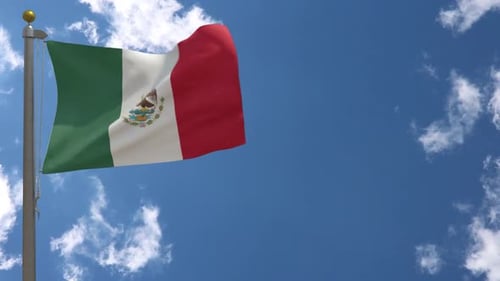 Mexican Flag Waving Seamlessly Against a Blue Sky