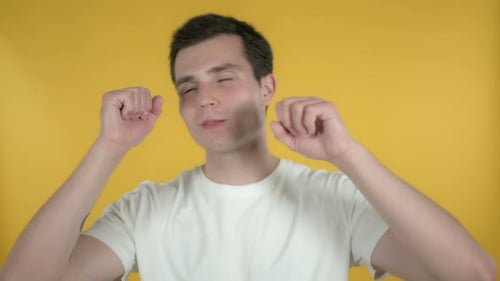 Man Dancing and Moving on Yellow Background