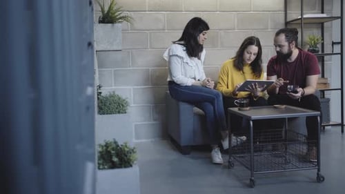 Team Collaborating Together in Urban Workplace